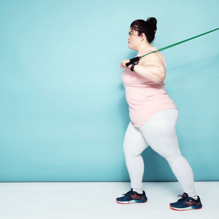 Woman demonstrating a chest press 