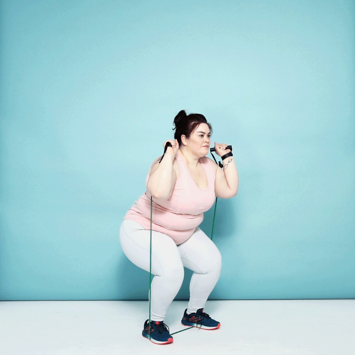 Woman demonstrating a thruster 